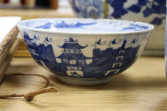 A 19th century Chinese blue and white punch bowl, Diameter 35cm. and three other bowls (a.f.)